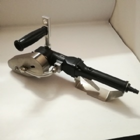 Pneumatic tool for trimming and stripping cardboard waste.